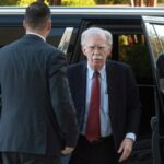 John Bolton surrenders to face charges of sharing classified information
